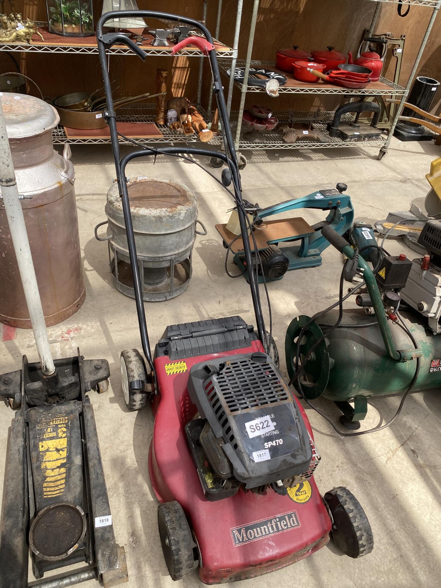 A MOUNTFIELD PETROL ENGINE LAWN MOWER LACKING THE GRASS BOX