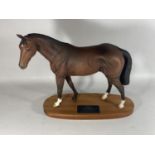 A BESWICK MATT CERAMIC MODEL OF DERBY WINNING RACEHORSE TROY ON WOODEN PLINTH BASE