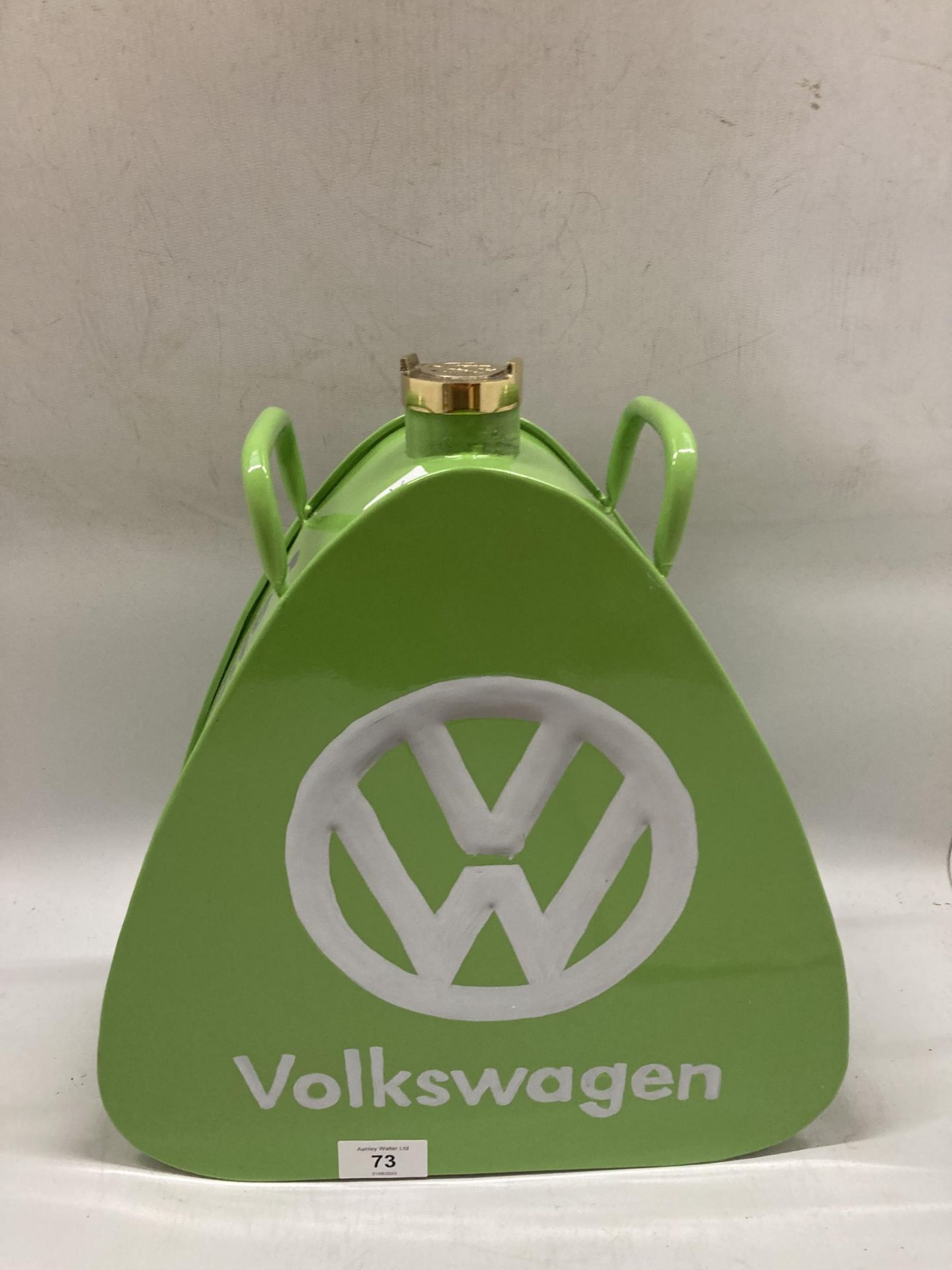 A GREEN VW METAL PETROL CAN WITH BRASS TOP