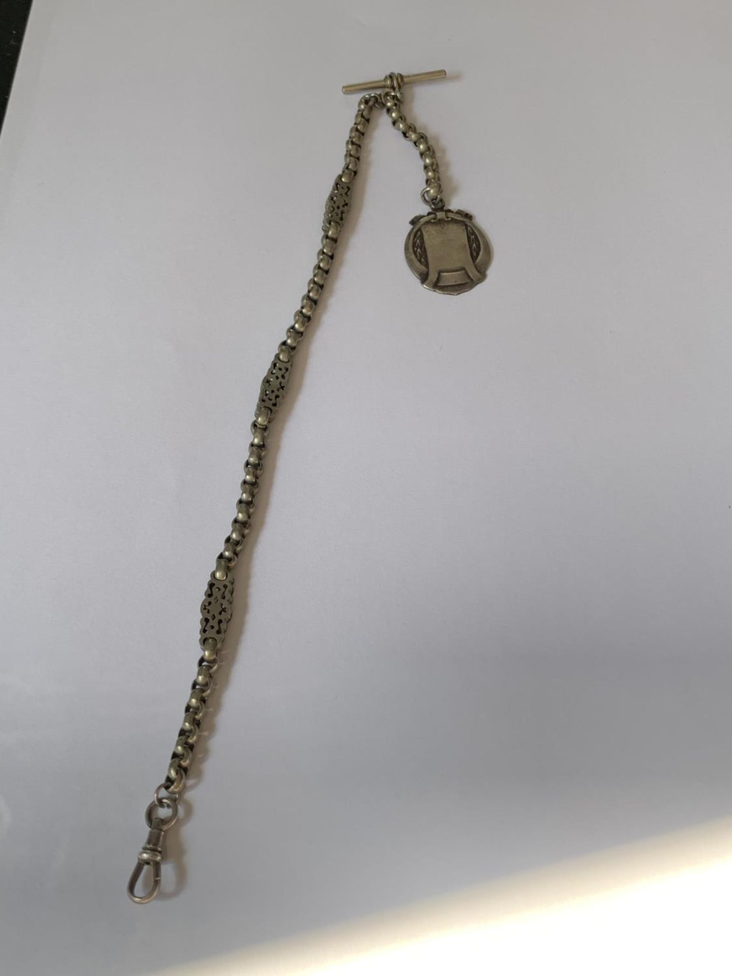 AN ORNATE HALF ALBERT WATCH CHAIN WITH FOB