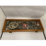 A WOODEN AND GLASS DISPLAY CASE OF ASSORTED COLLECTABLE ITEMS