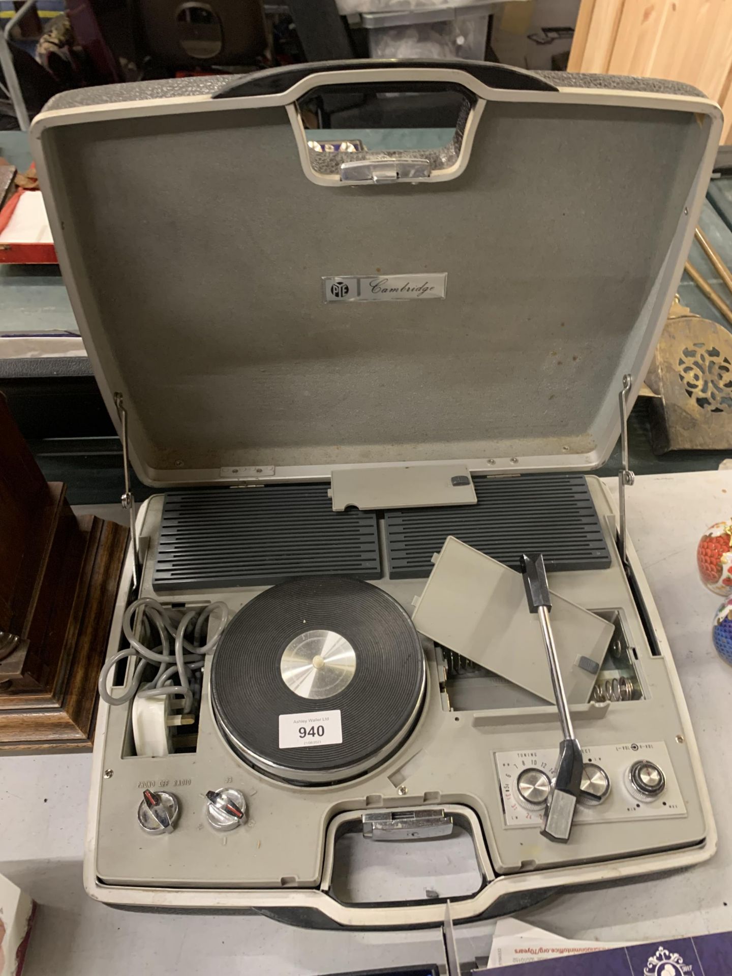 A VINTAGE PYE PORTABLE RECORD PLAYER IN A CASE