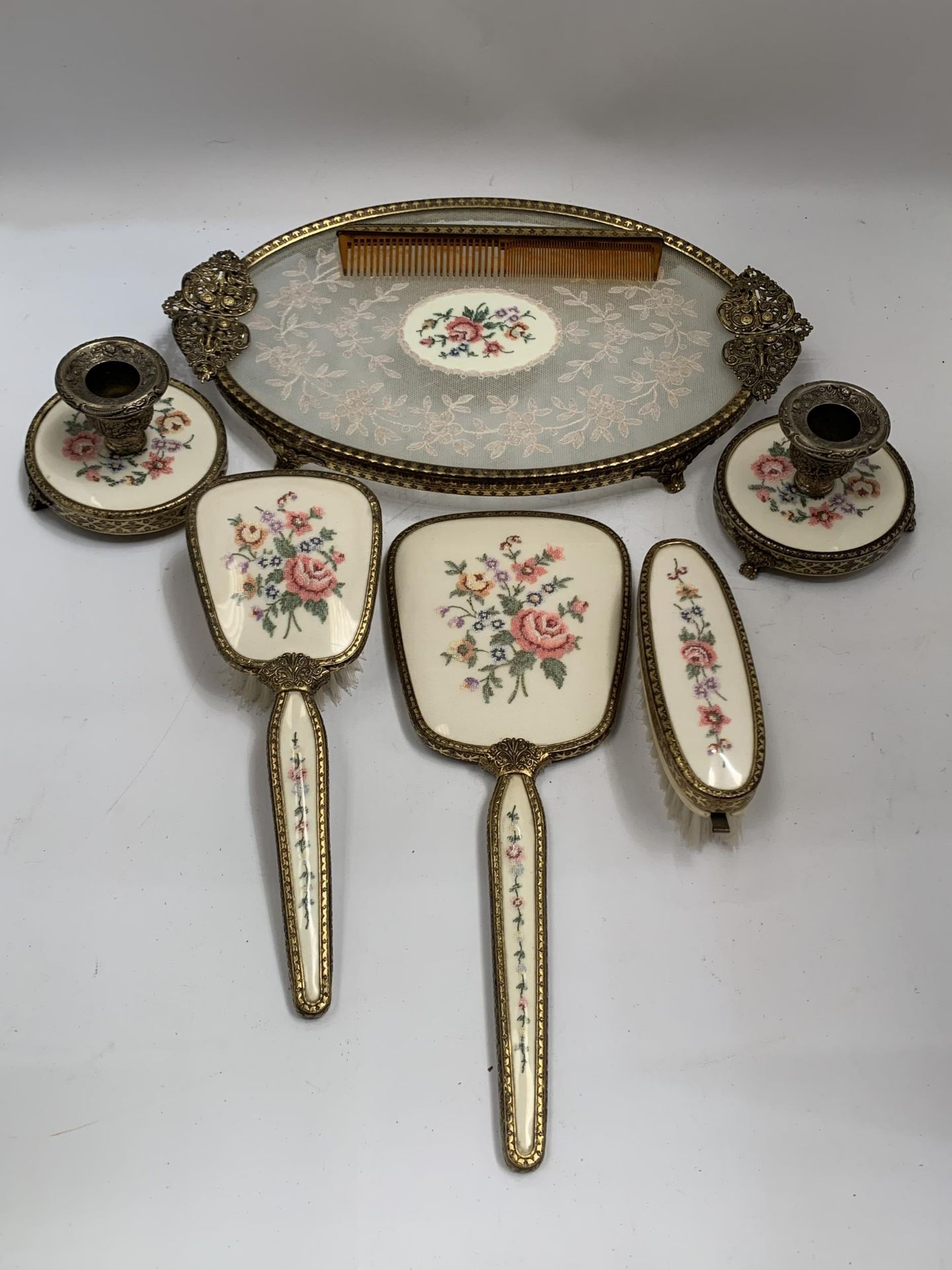 A VINTAGE FLORAL EMBROIDERED DRESSING SET WITH TRAY AND CANDLESTICKS ETC