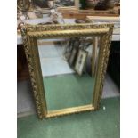 A LARGE GILT FRAMED BEVEL EDGED WALL MIRROR, 57 X 82CM