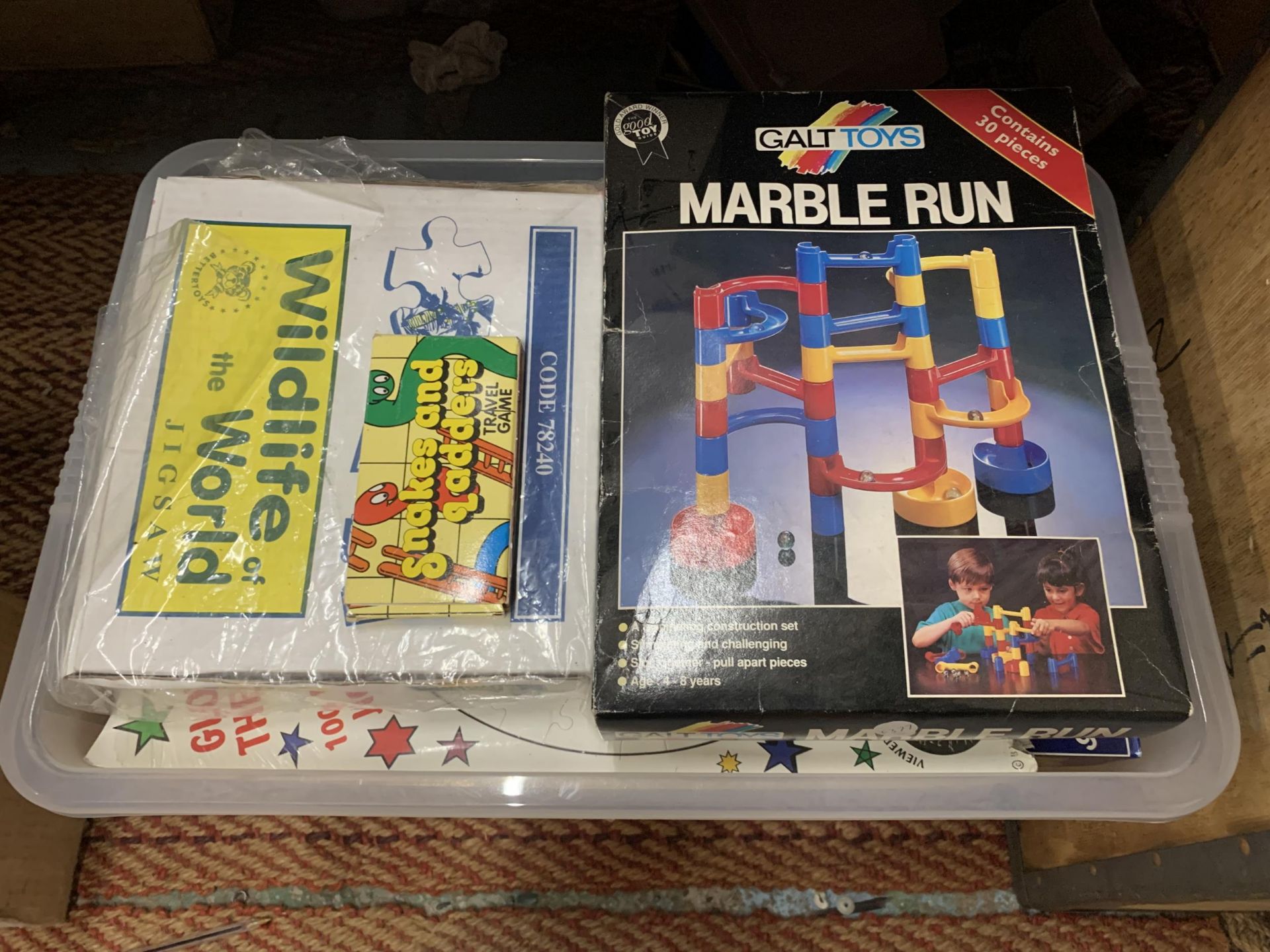 A QUANTITY OF JIGSAWS AND GAMES