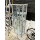 A GLASS SHOP DISPLAY UNIT WITH INTERNAL GLASS SHELVES
