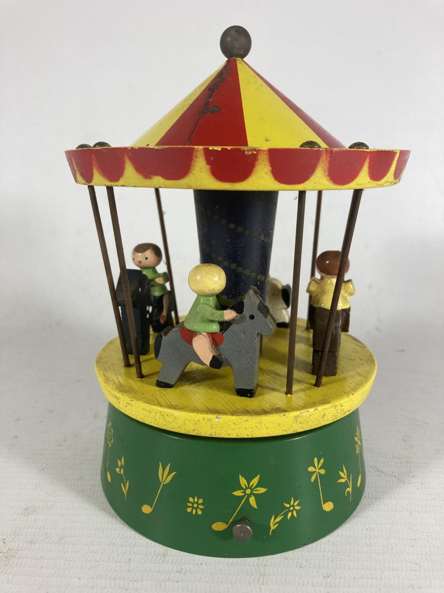 A RARE VINTAGE REUGE WODDEN MERRY-GO-ROUND WITH SWISS MUSICAL MOVEMENT