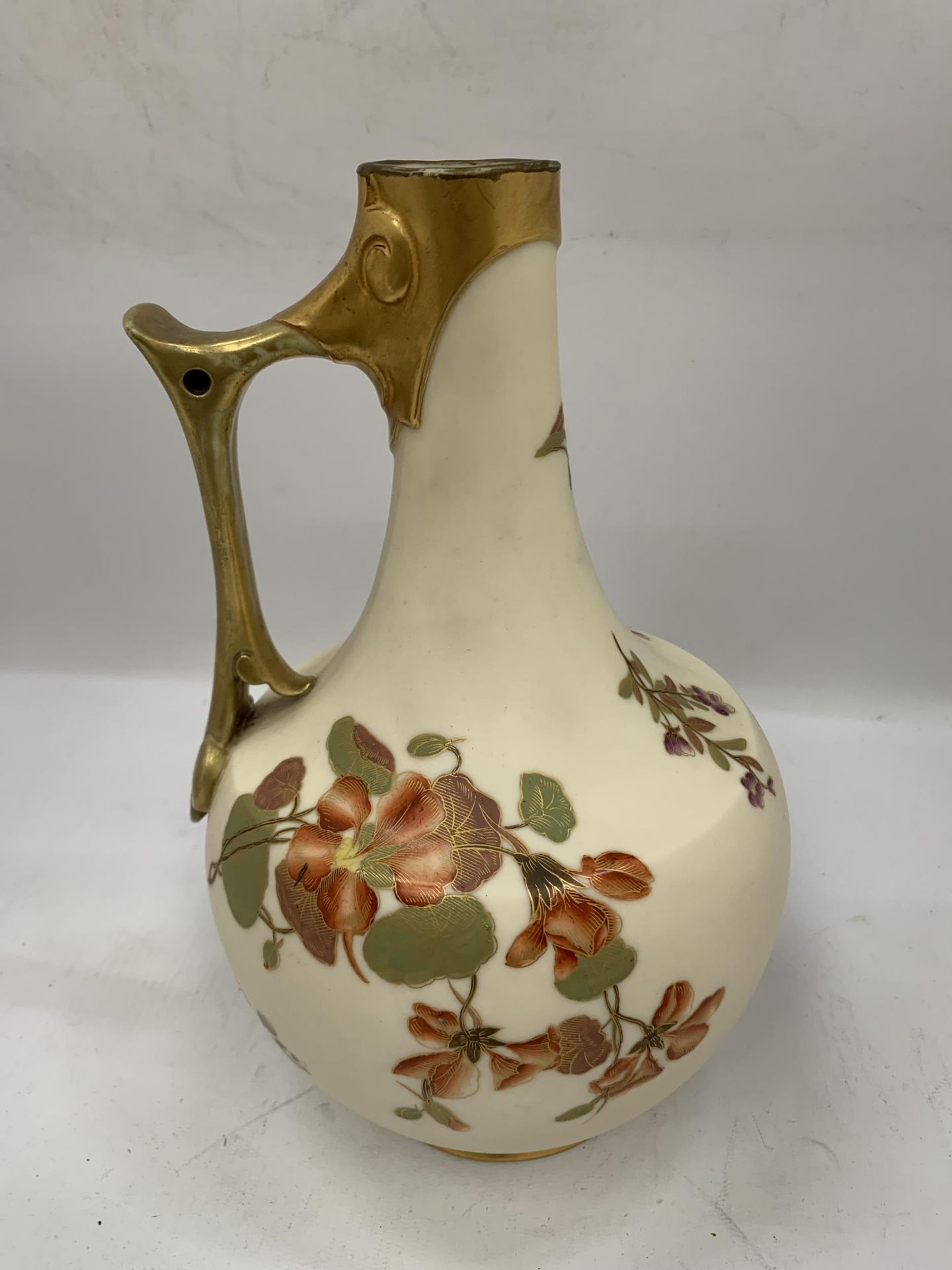 A ROYAL WORCESTER BLUSH IVORY HAND PAINTED JUG, HEIGHT 27CM