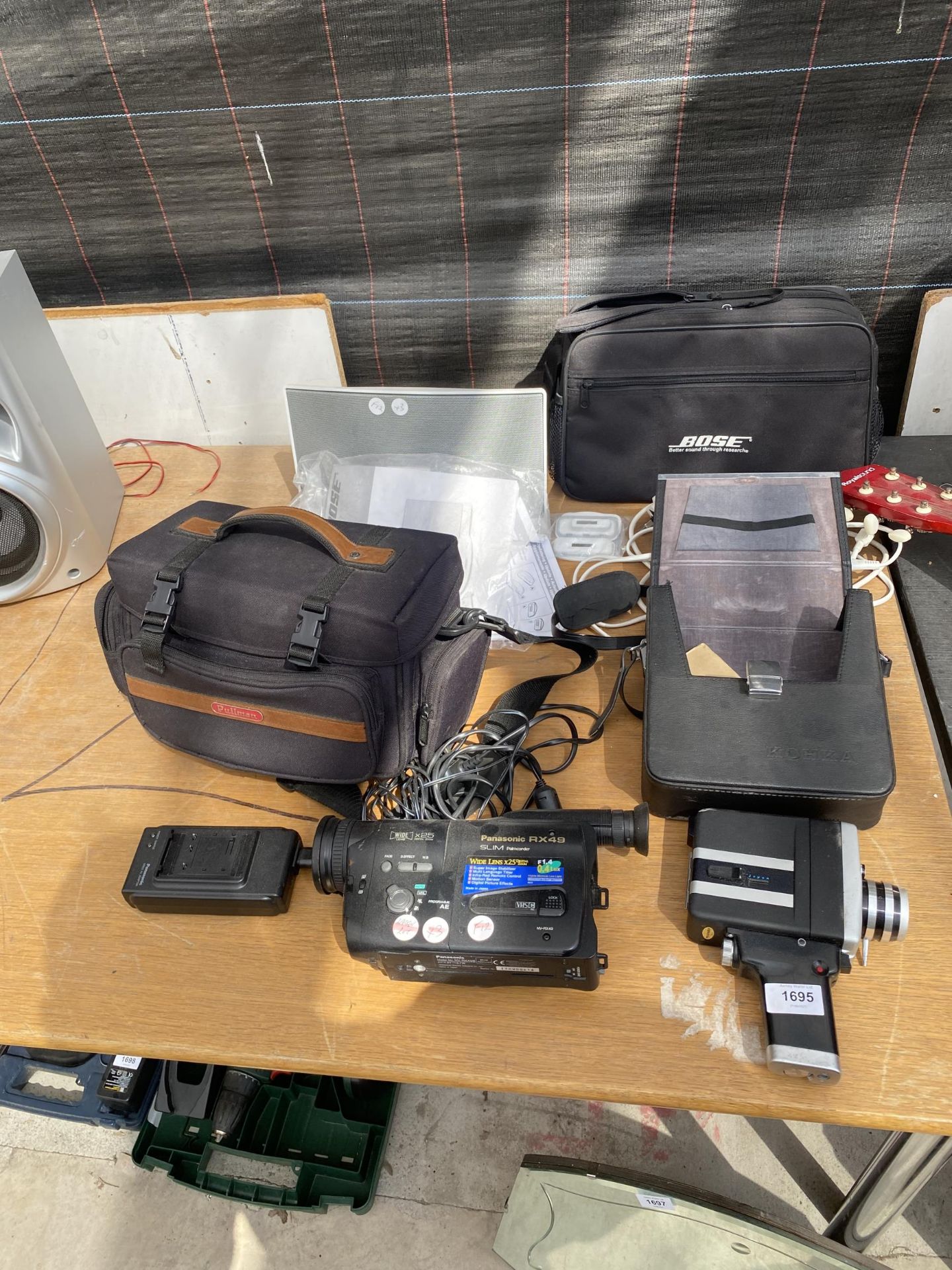 AN ASSORTMENT OF ELECTRICAL EQUIPMENT TO INCLUDE A PANASONIC CAMCORDER AND A BOSE DOCKING STATION