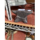 A MINIATURE CAST IRON SAMPLE ANVIL