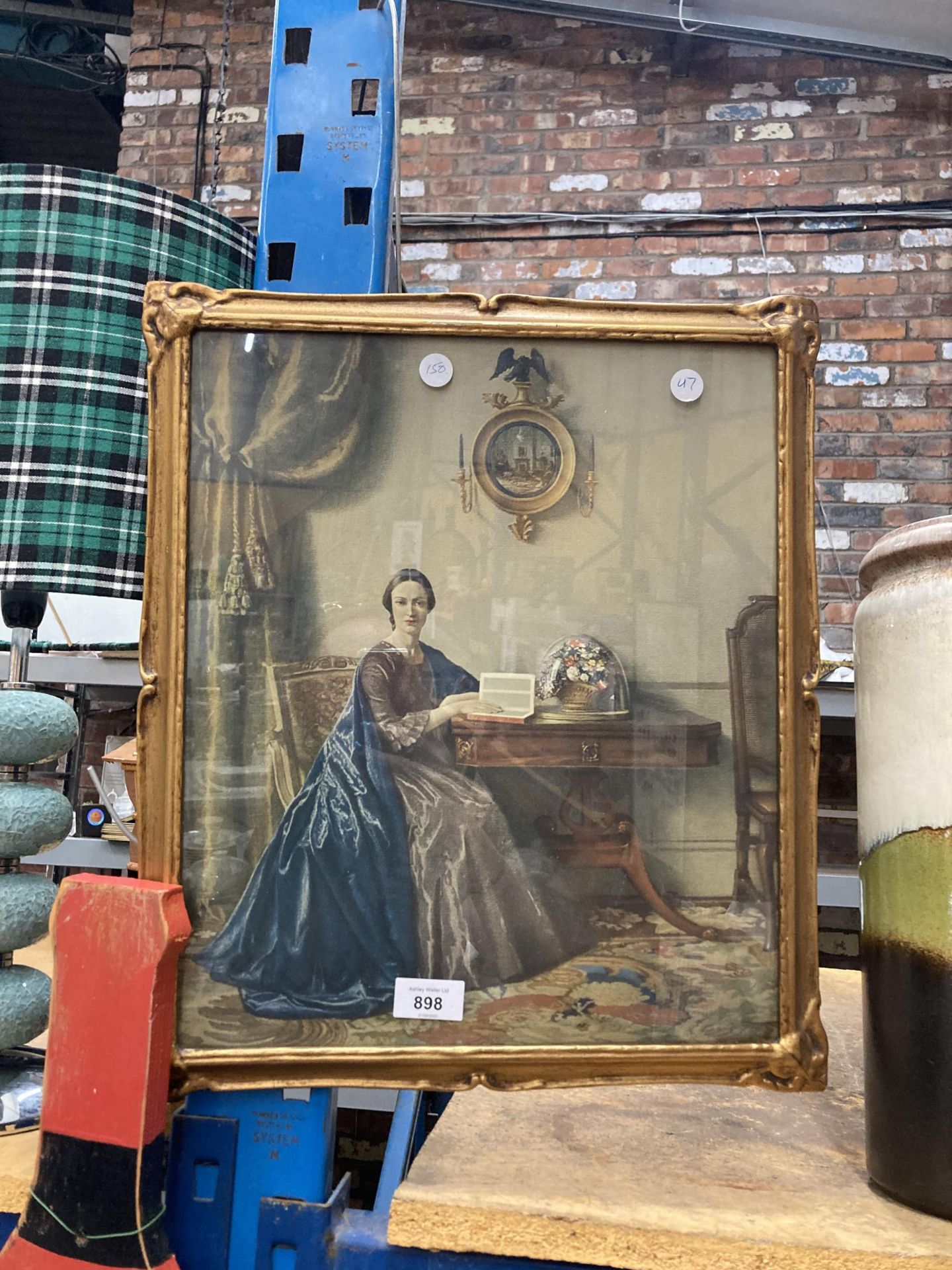 A FRAMED VICTORIAN PRINT IN A GILT FRAME