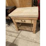 A RUSTIC PINE BUTCHERS BLOCK (96CM x 70CM x 90CM)