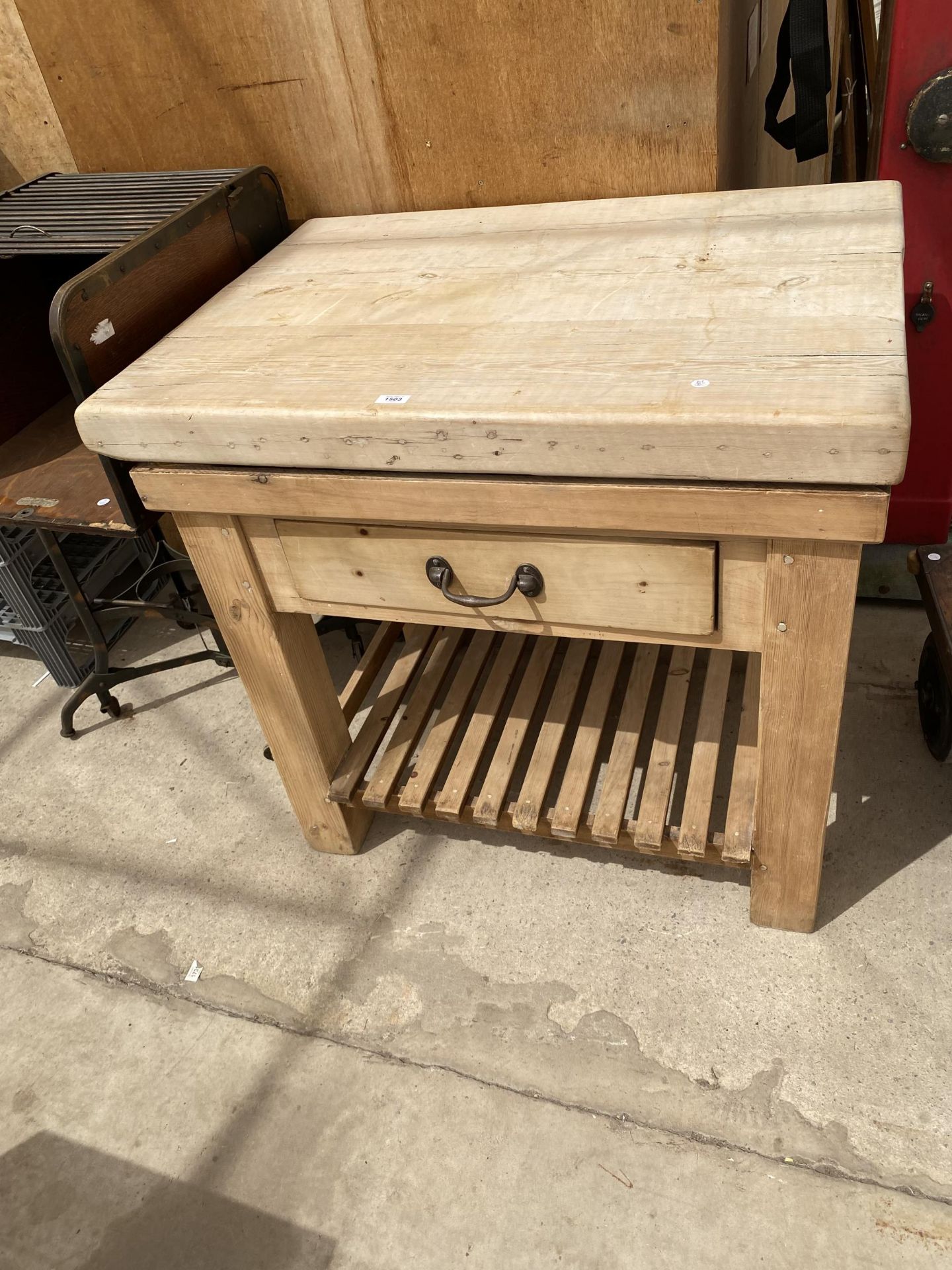 A RUSTIC PINE BUTCHERS BLOCK (96CM x 70CM x 90CM)