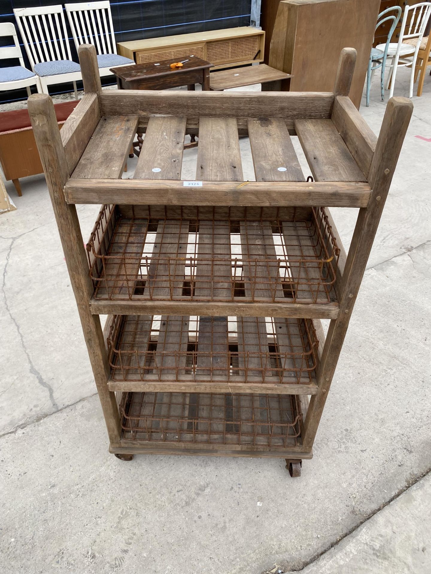 A TALL RUSTIC FOUR TIER WOODEN FOUR WHEELED STAND WITH WIRE BASKET TRAYS - Image 2 of 6