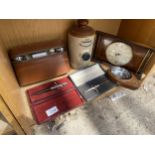 AN ASSORTMENT OF ITEMS TO INCLUDE A CLOCK, PENS AND A STONEWARE FOOTWARMER ETC