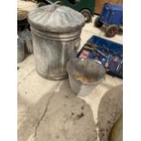A GALVANISED DUSTBIN WITH LID AND A GALVANISED BUCKET