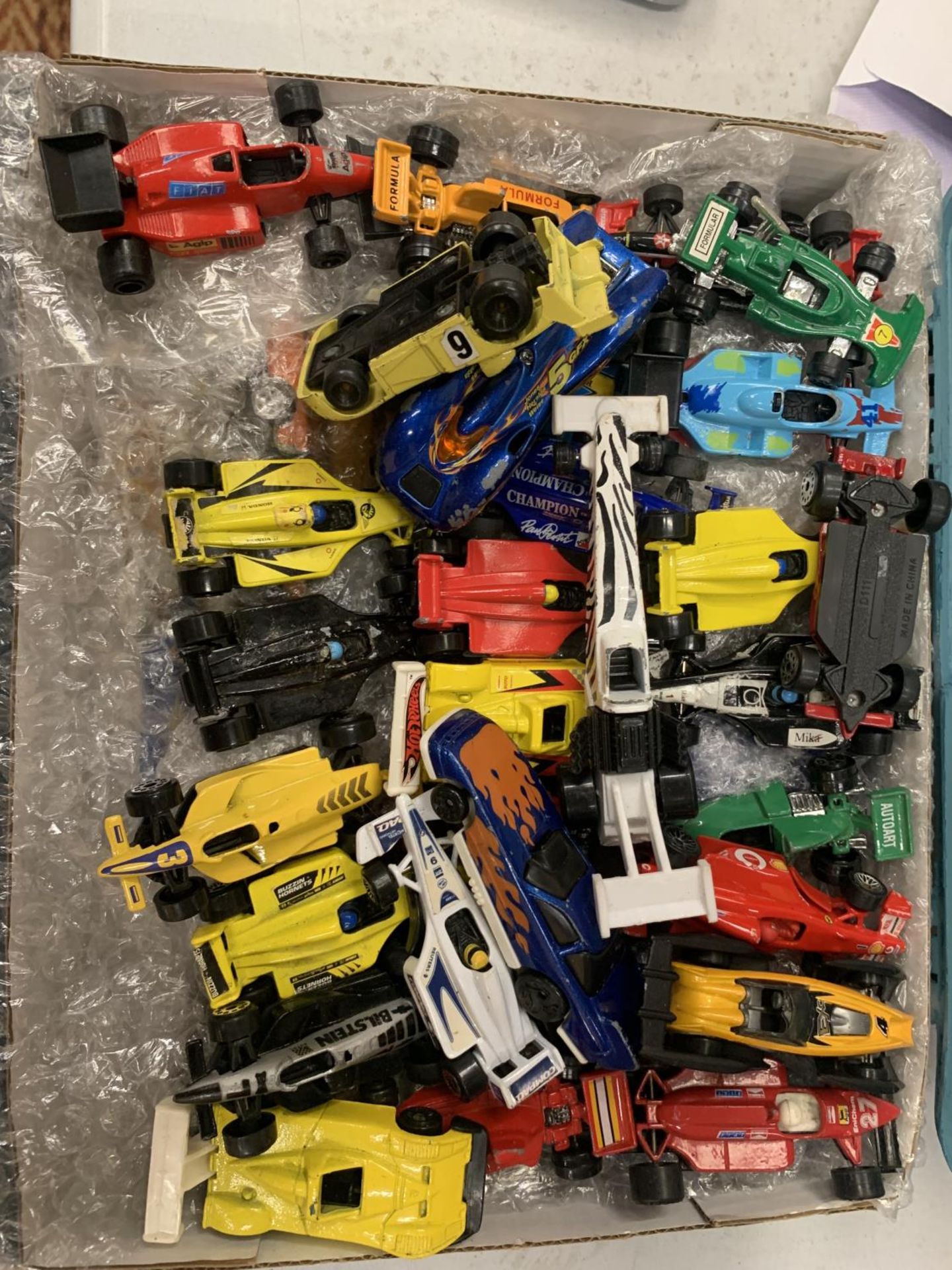 TWENTY SIX SMALL UNBOXED CARS AND THIRTY RACING CARS