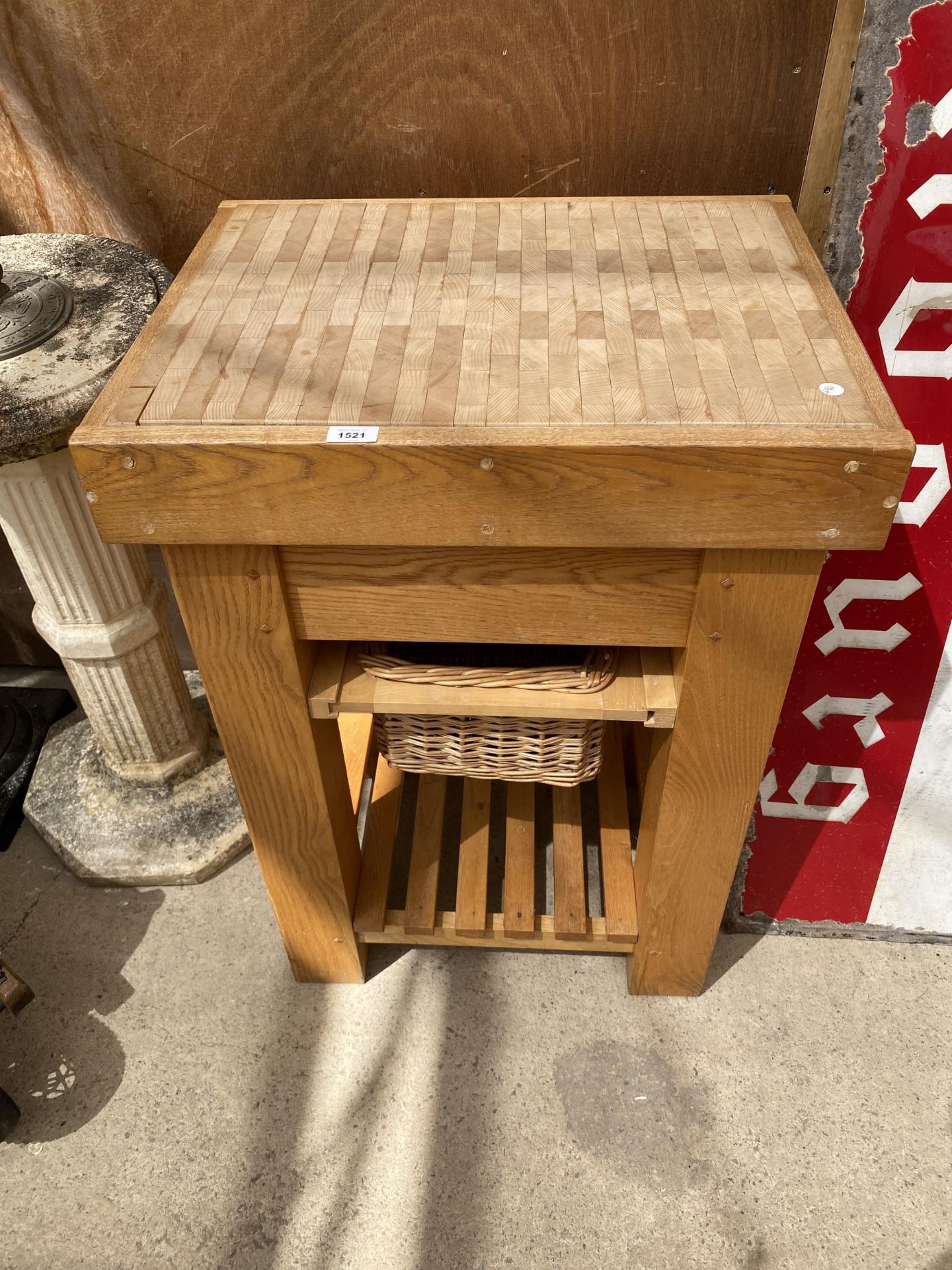 A SMALL OAK BUTCHERS BLOCK