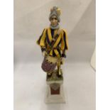 AN ITALIAN CERAMIC FIGURE OF A JESTER WITH SIGNATURE TO BASE HEIGHT 42CM