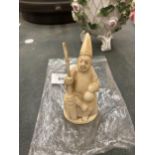 A CARVED BONE FIGURE HEIGHT 9CM