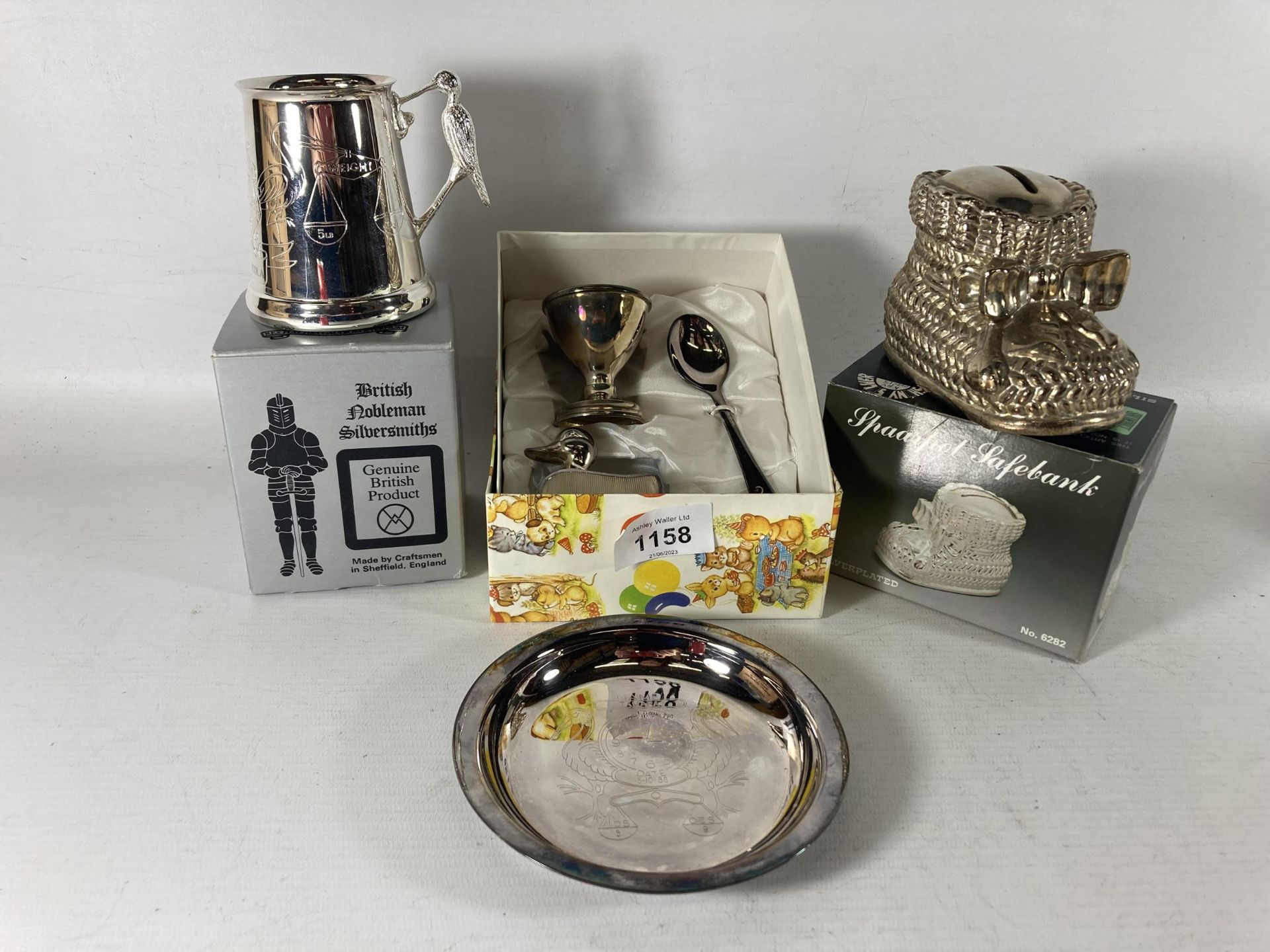 A QUANTITY OF SILVER PLATED BABY ITEMS TO INCLUDE A TANKARD, BOOTIE MONEY BOX, SMALL PLATE AND EGG