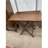 AN ORIENTAL HARDWOOD AND CANE TWO HANDLED TRAY ON HEAVILY CARVED X-FRAME STAND, 38X24"