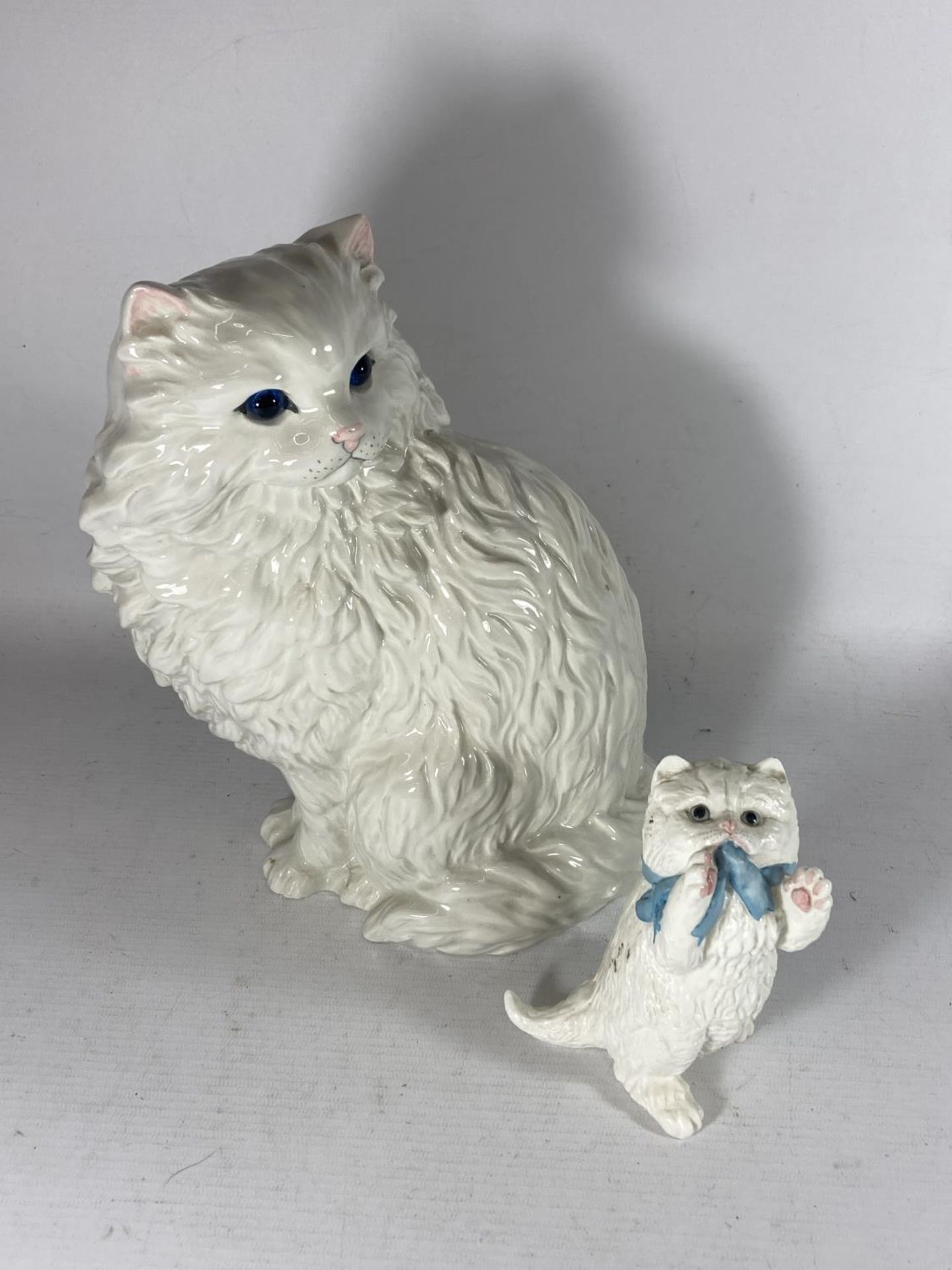 TWO WHITE CATS TO INCLUDE A ROYAL WORCESTER AND A JUST CAT & CO