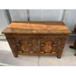 AN 18TH CENTURY STYLE OAK RUG/BLANKET CHEST WITH CARVED FRONT PANELS AND DROP-IN SLIDING TRAY, 42"