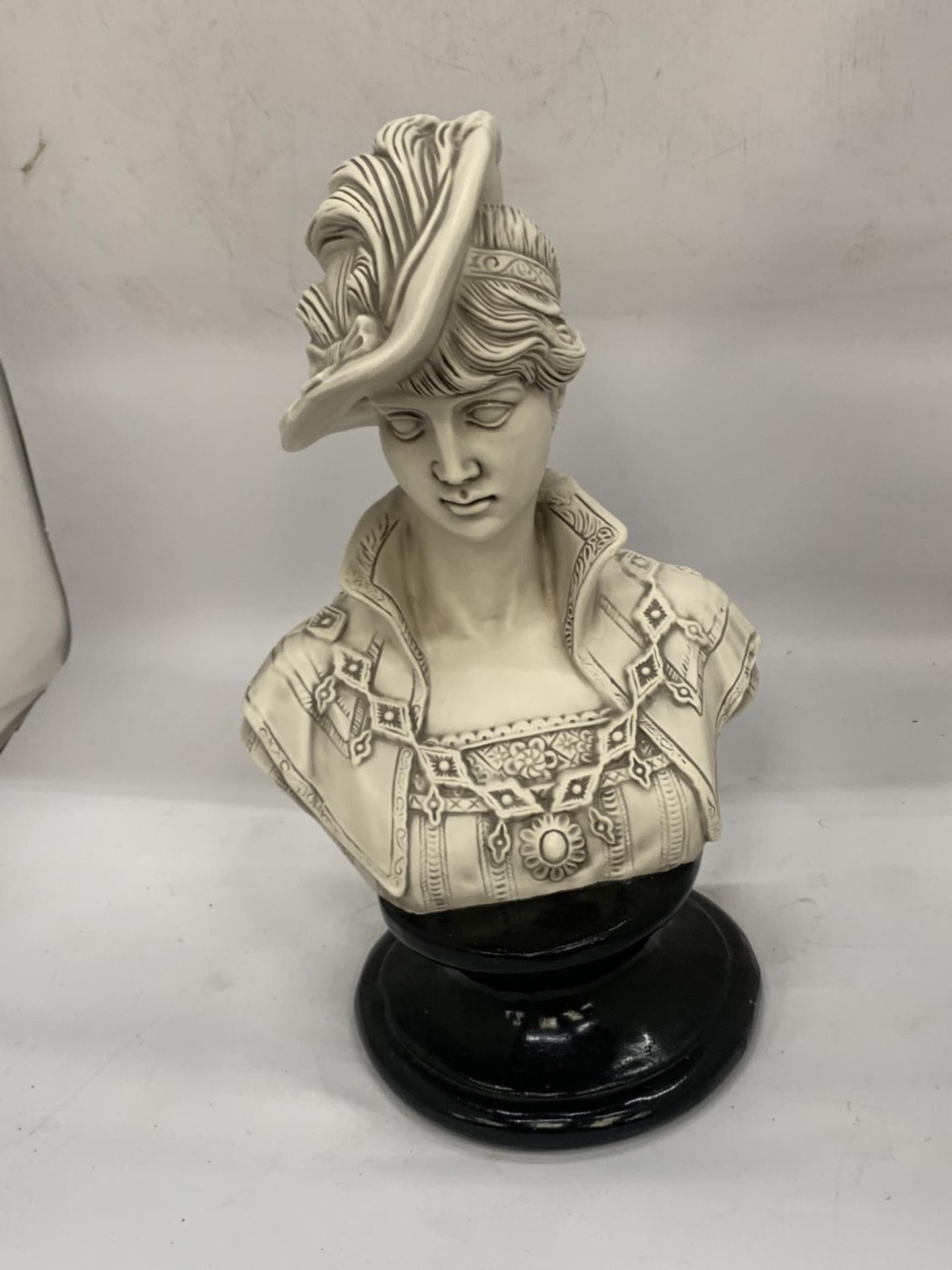 A BUST OF A LADY ON A PLINTH HEIGHT 39CM