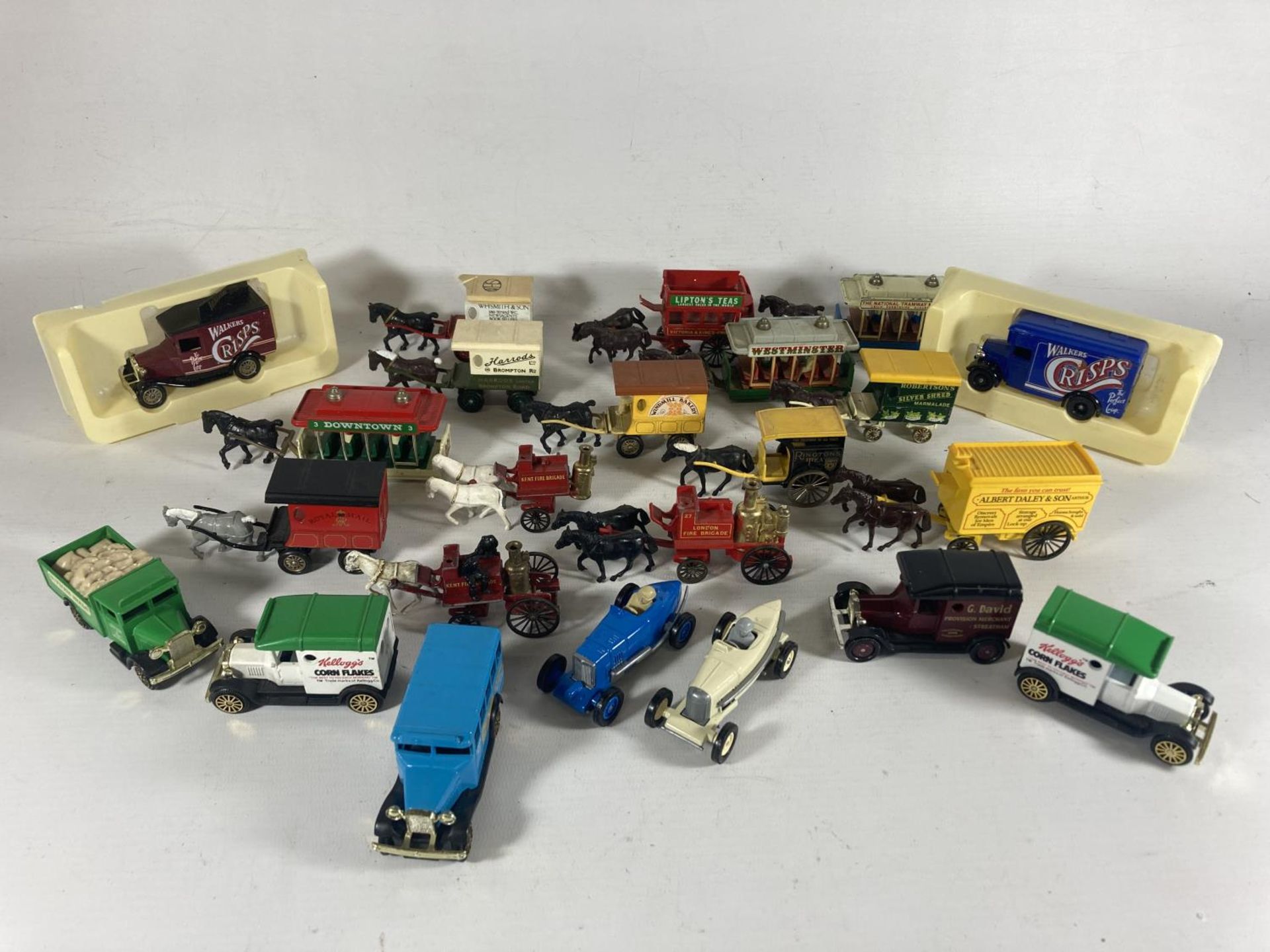 A TRAY OF LLEDO HORSE DRAWN VEHICLES AND SOME BOXED CORGI VINTAGE VANS