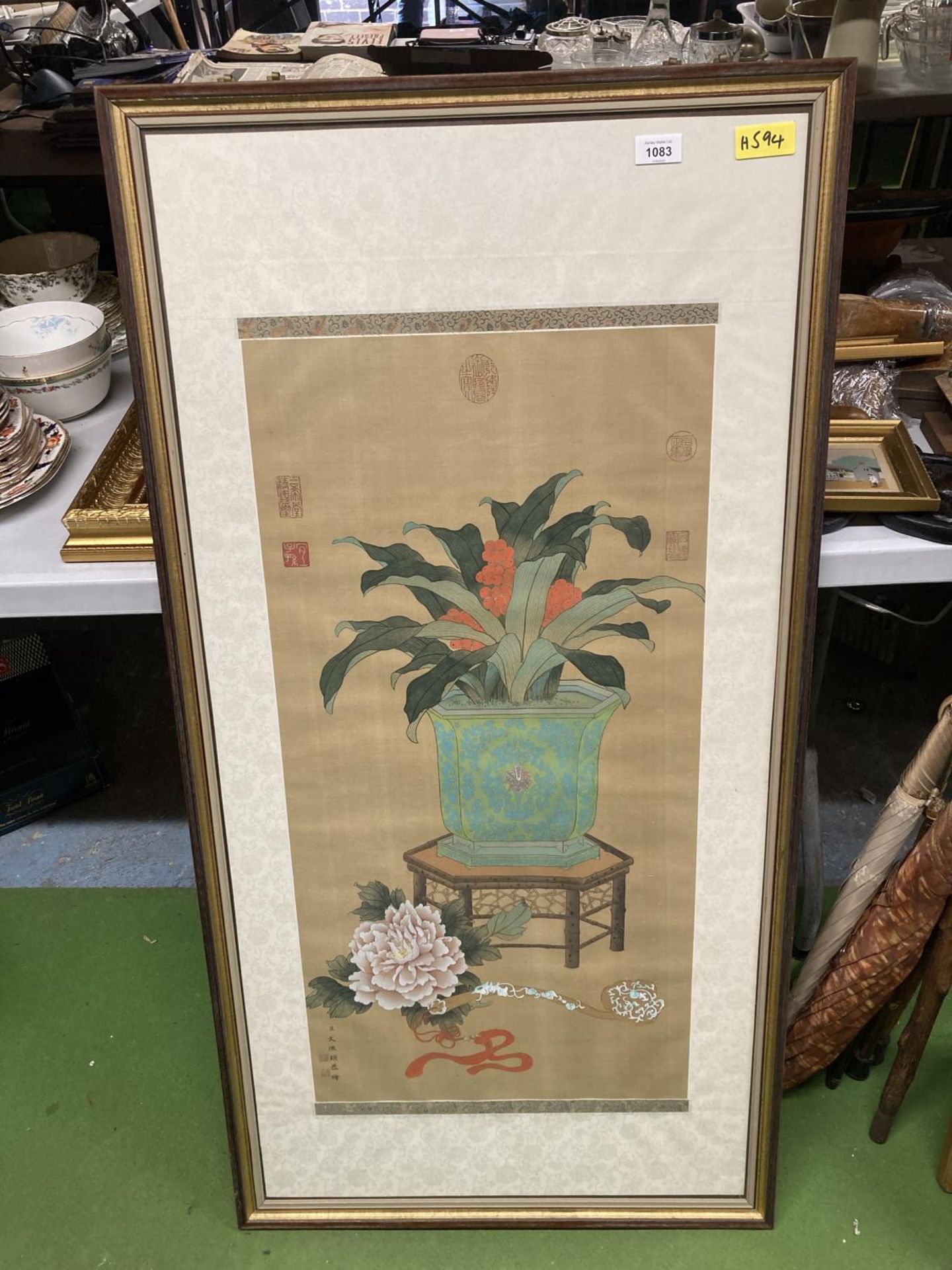 A LARGE FRAMED ORIENTAL PRINT OF A VASE WITH FLOWERS