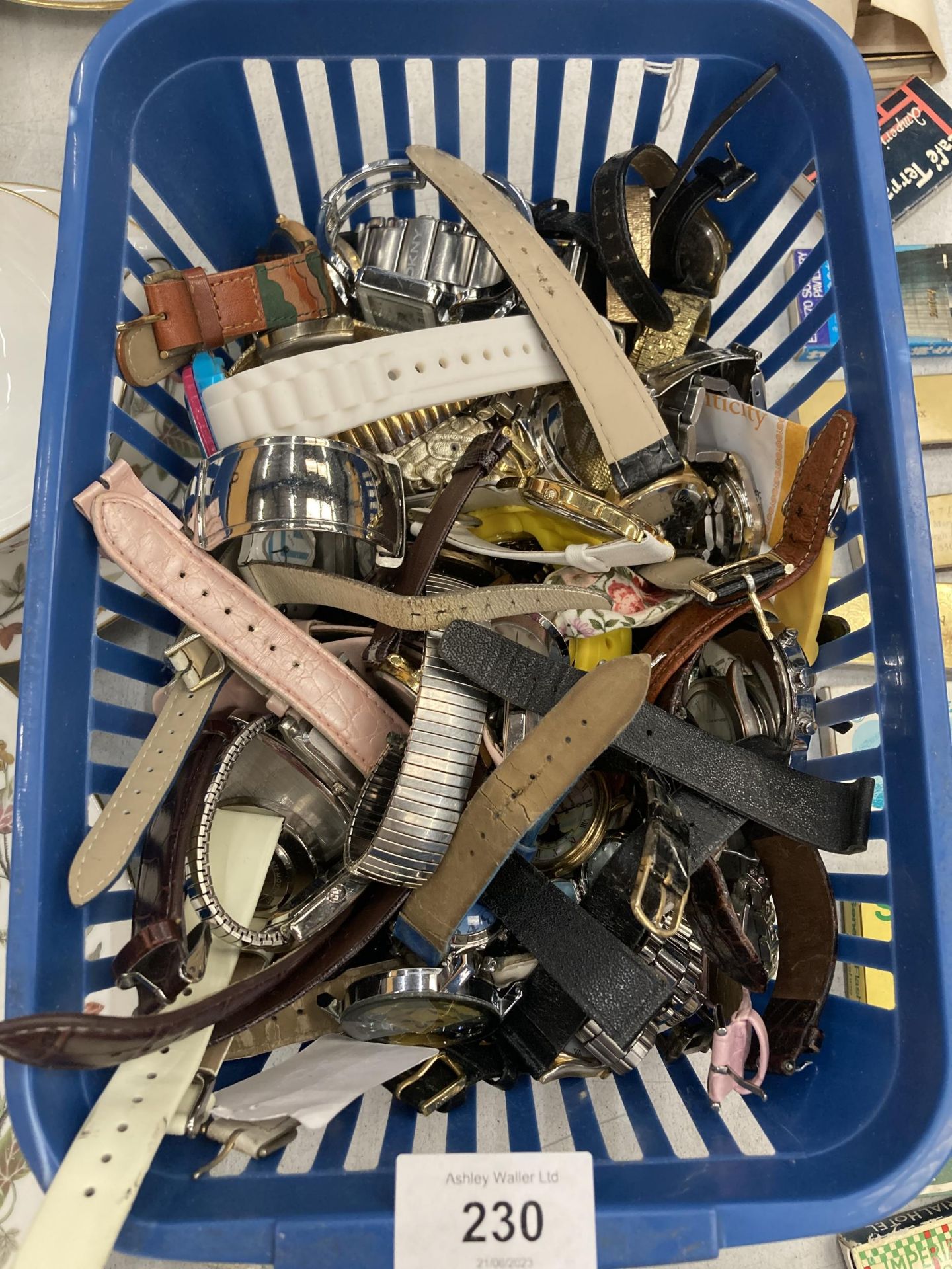 A BASKET OF ASSORTED WATCHES