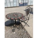 A METAL AND TILE TOPPED BISTRO TABLE AND SINGLE CHAIR