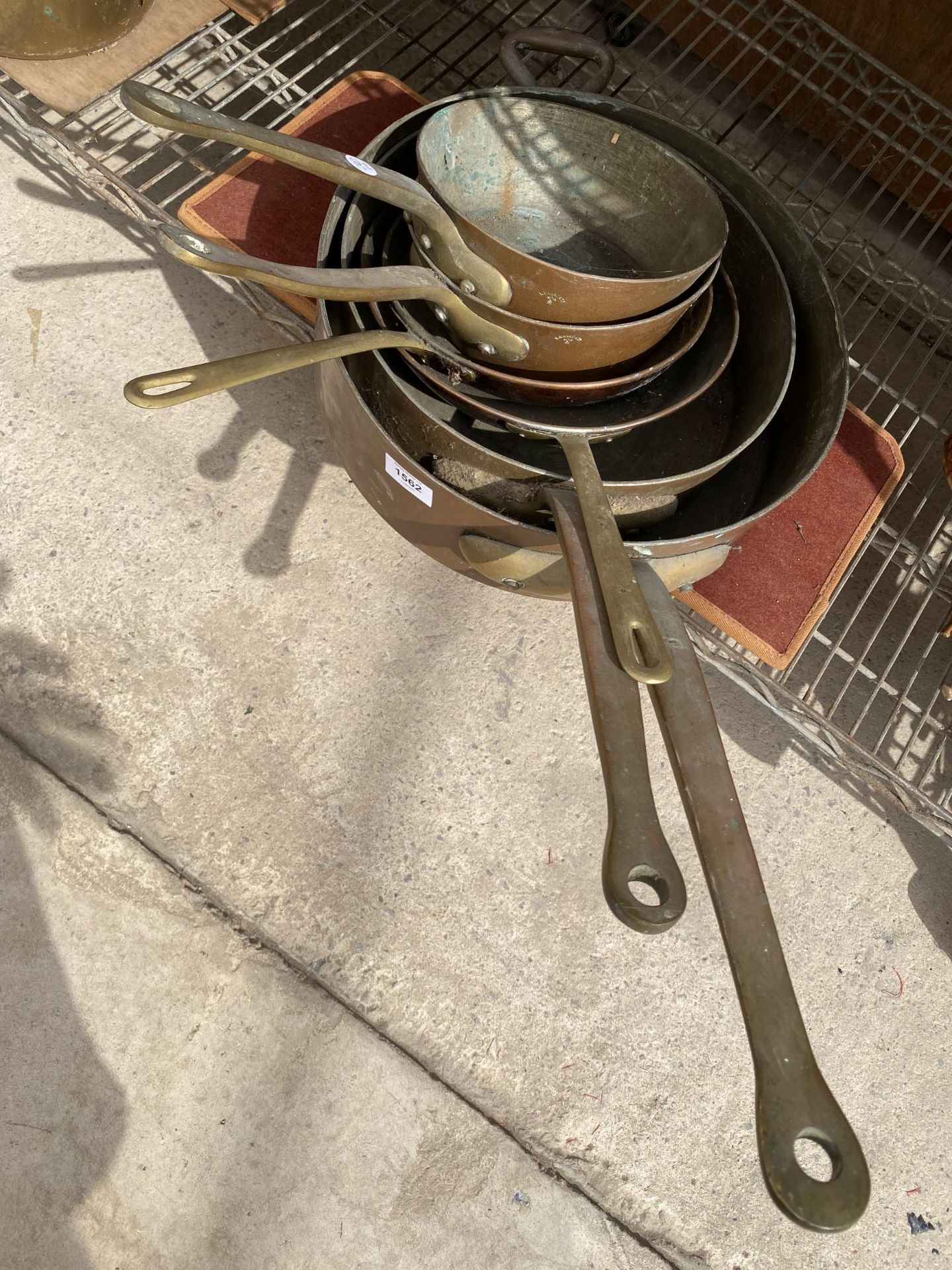 SIX VINTAGE BRASS AND COPPER COOKING PANS