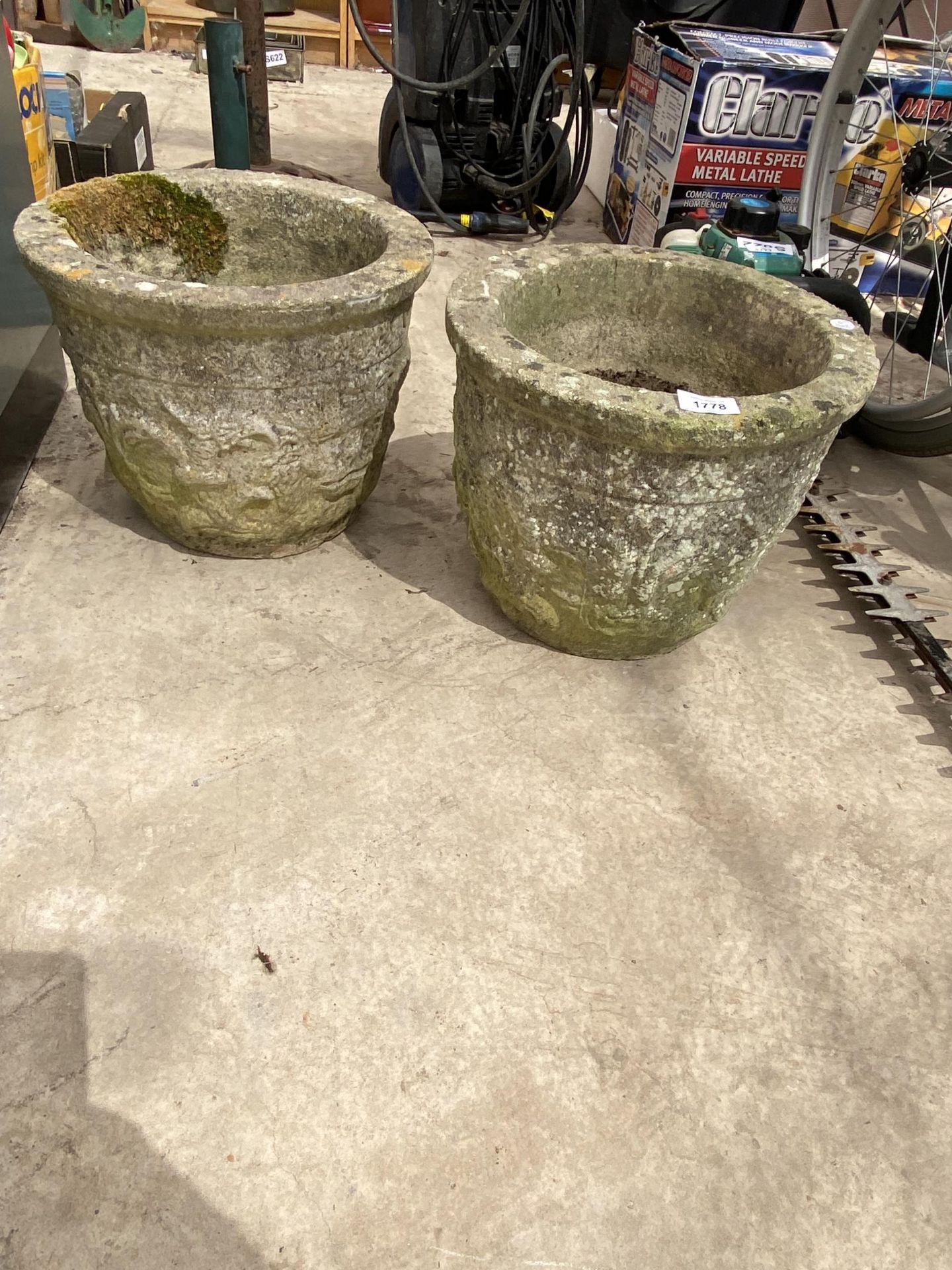 A PAIR OF RECONSTITUTED STONE GARDEN PLANTERS