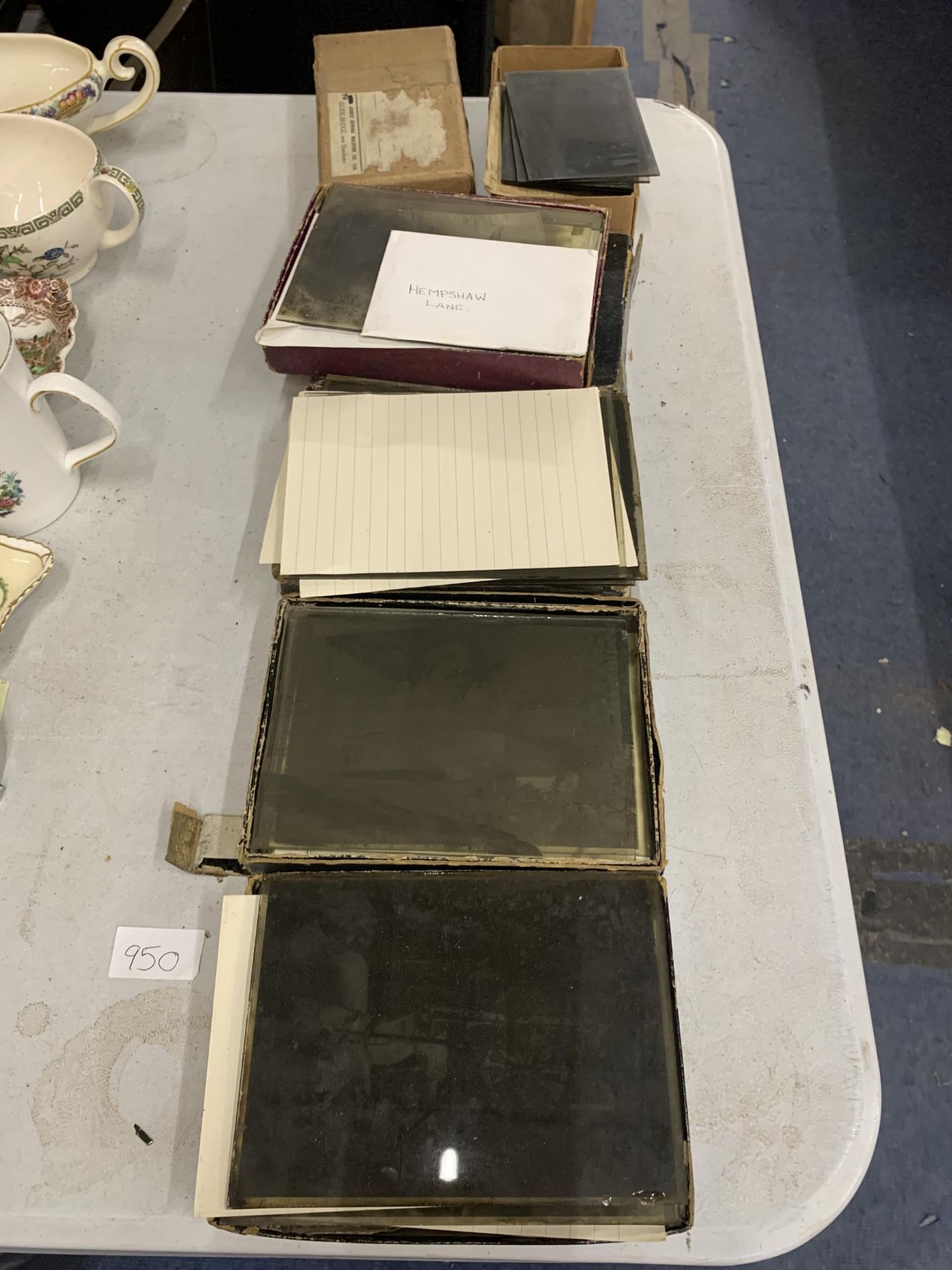 A COLLECTION OF GLASS ILFORD DRY PLATES WITH PHOTOGRAPHIC IMAGES ON THEM
