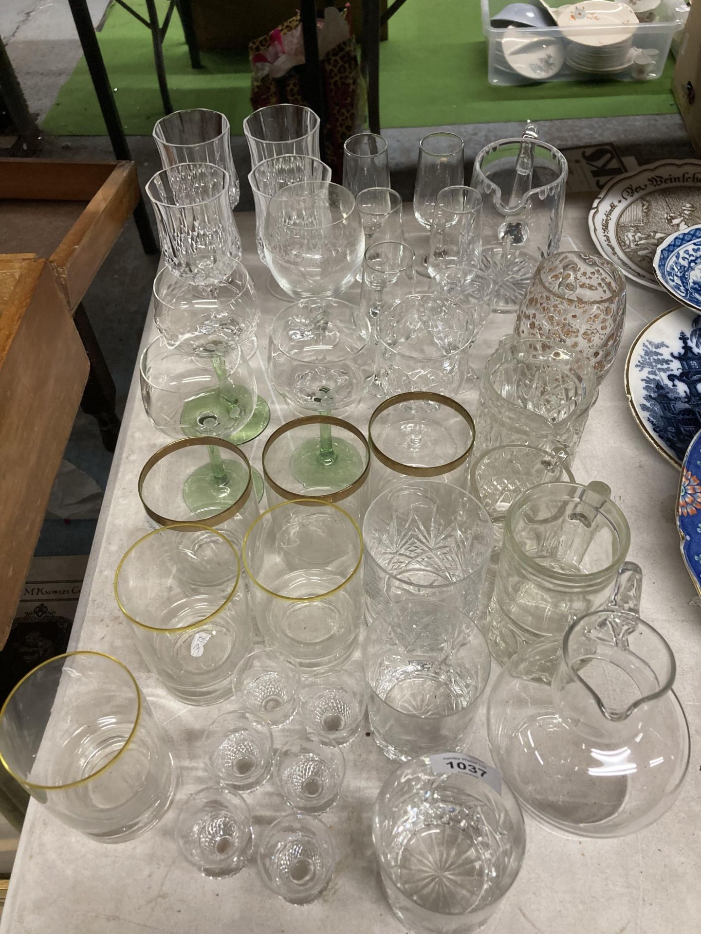 A LARGE QUANTITY OF GLASSES TO INCLUDE WINE, SHERRY, TUMBLERS, JUGS, ETC