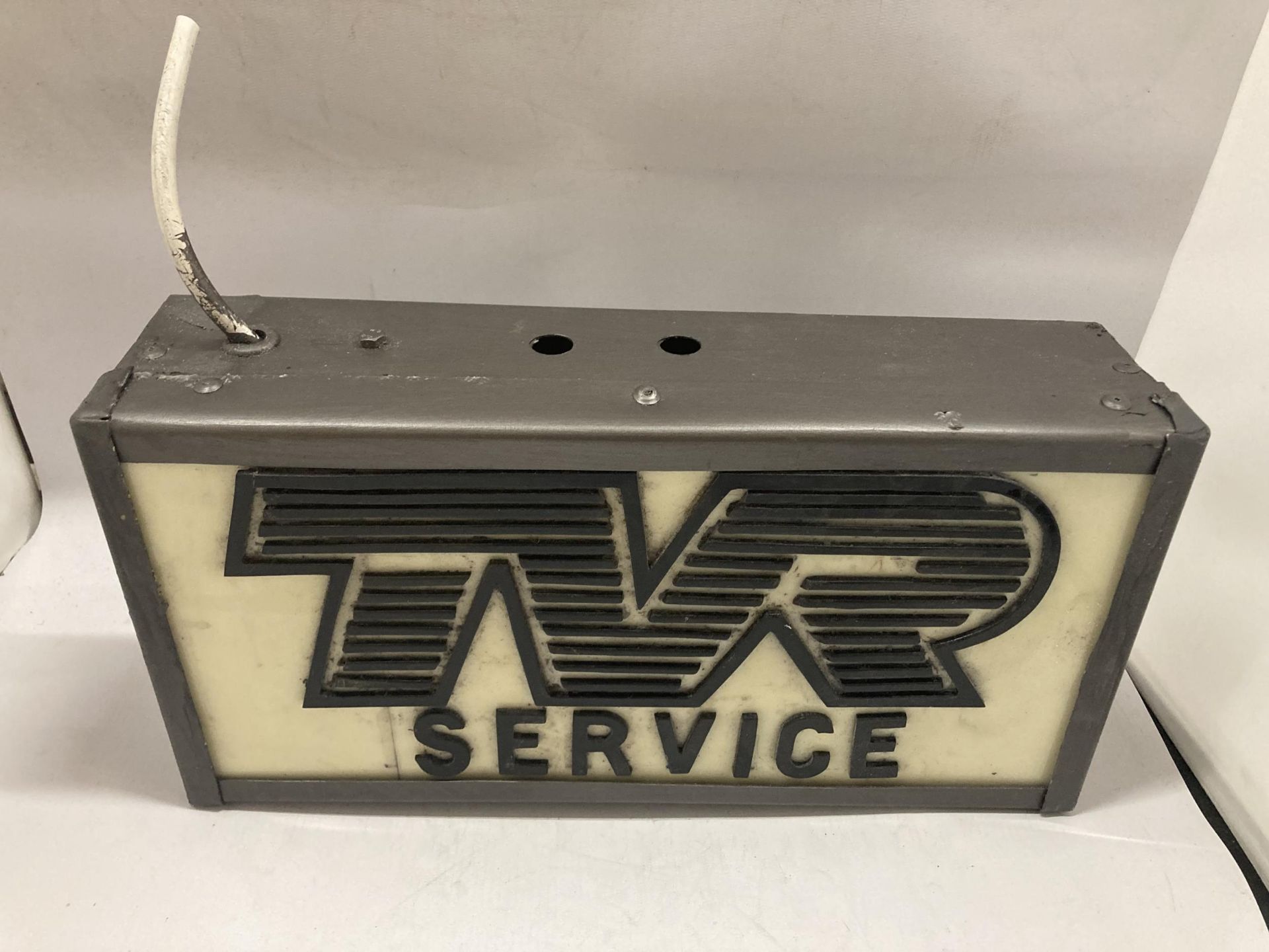 A TVR SERVICE ILLUMINATED BOX SIGN