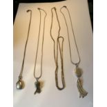 FOUR SILVER NECKLACES WITH THREE WITH PENDANTS