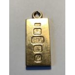 A 9 CARAT GOLD INGOT PENDANT GROSS WEIGHT 8.86 GRAMS