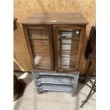 A VINTAGE OAK ENTOMOLOGY CABINET WITH 42 DRAWERS AND GLASS DOORS