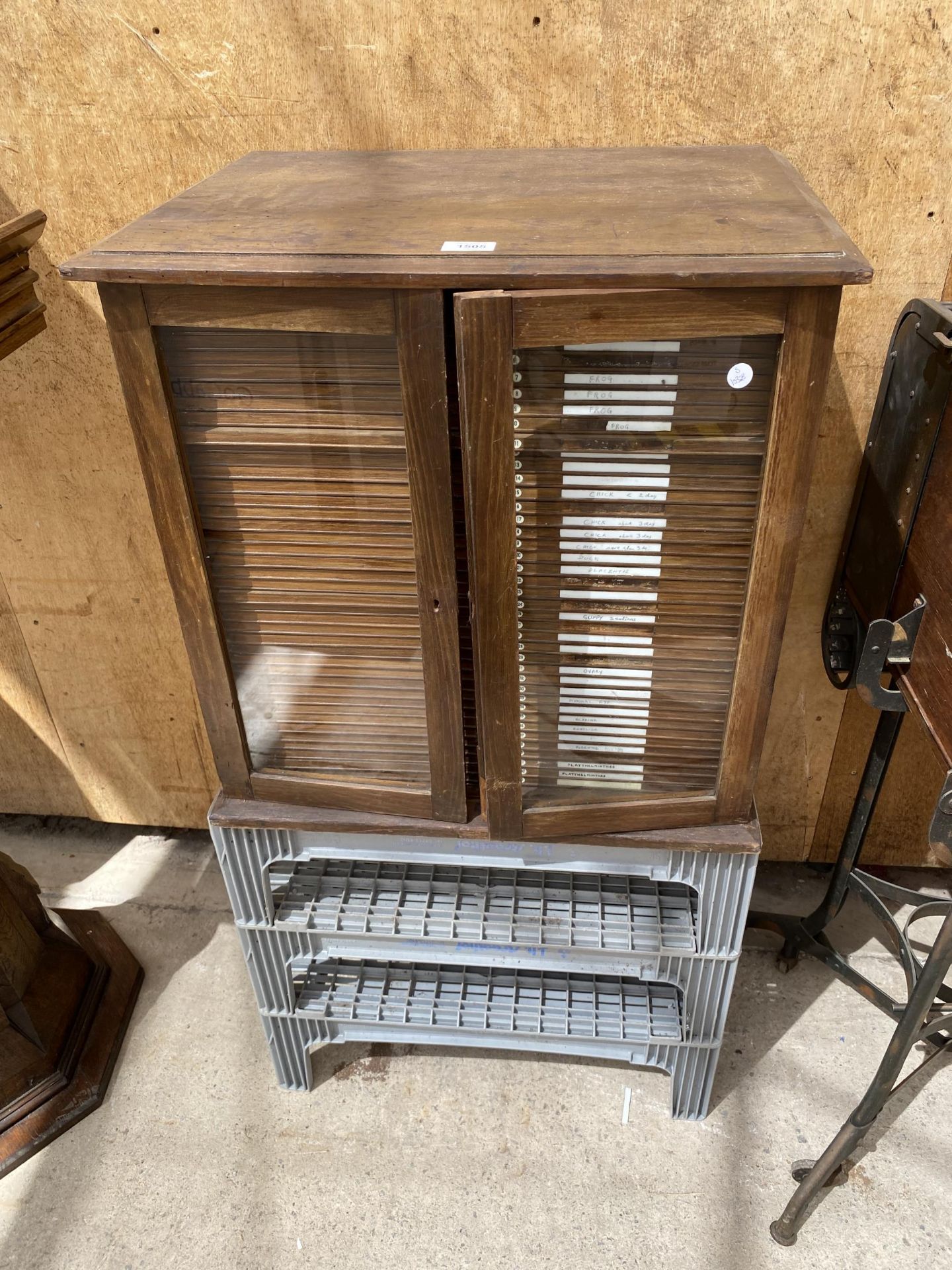 A VINTAGE OAK ENTOMOLOGY CABINET WITH 42 DRAWERS AND GLASS DOORS