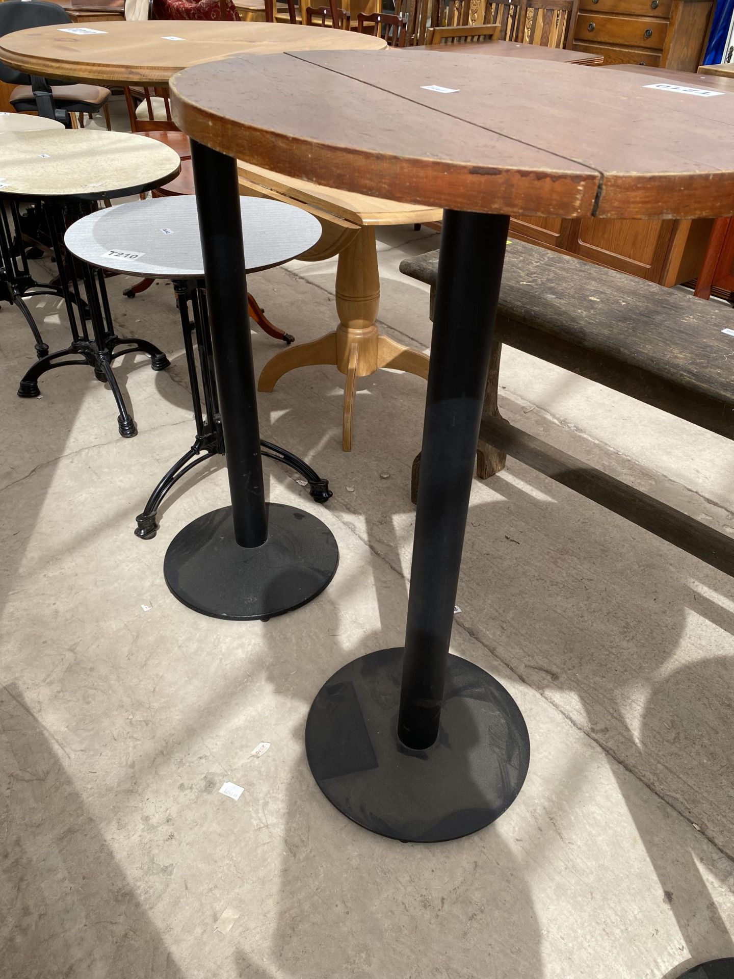 TWO TALL PUB TABLES, 24 AND 26" DIAMETER, ON BLACK METALWARE BASES - Bild 2 aus 2