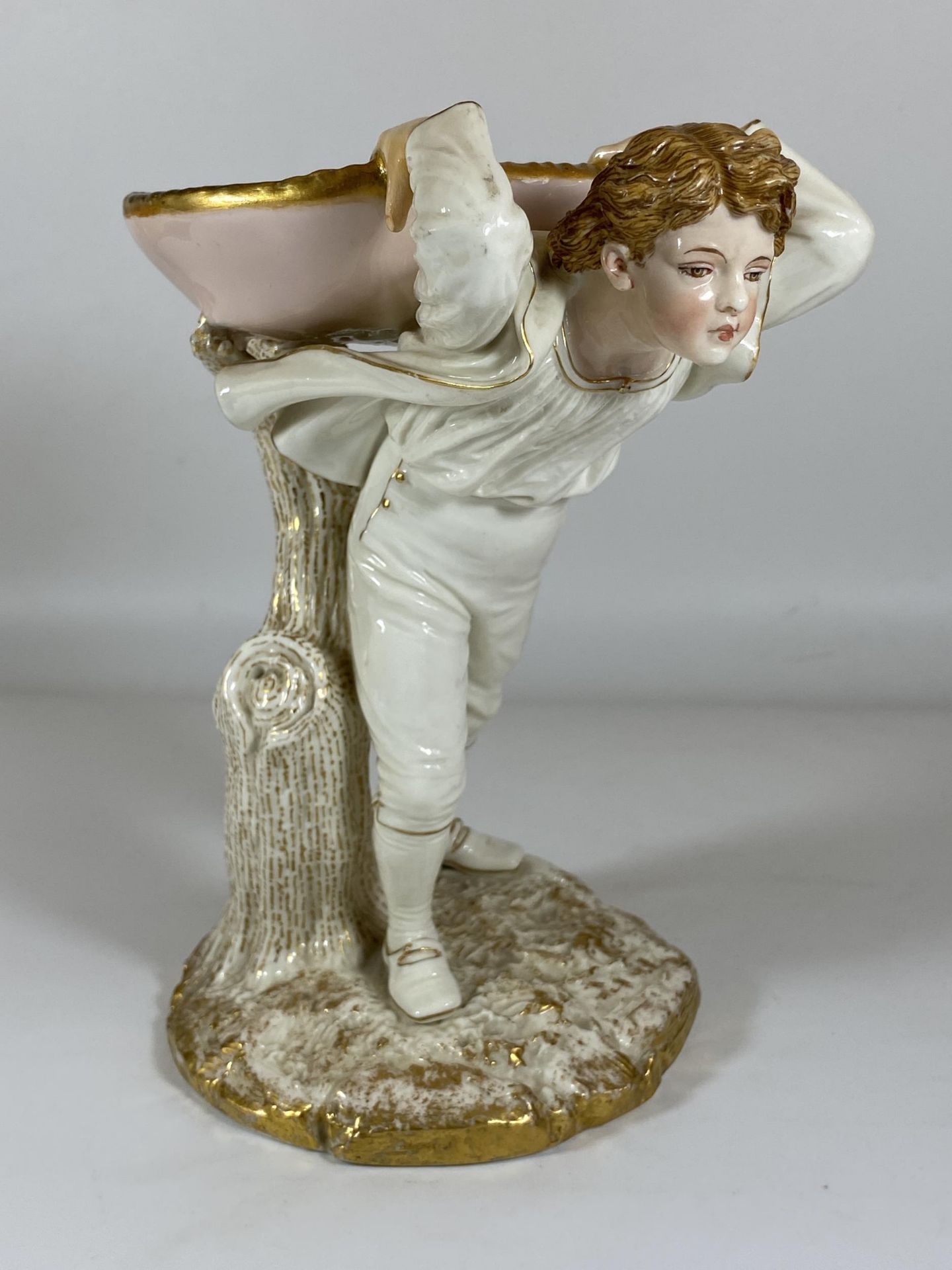 A LATE 19TH CENTURY ROYAL WORCESTER FIGURE OF A BOY HEIGHT 21CM