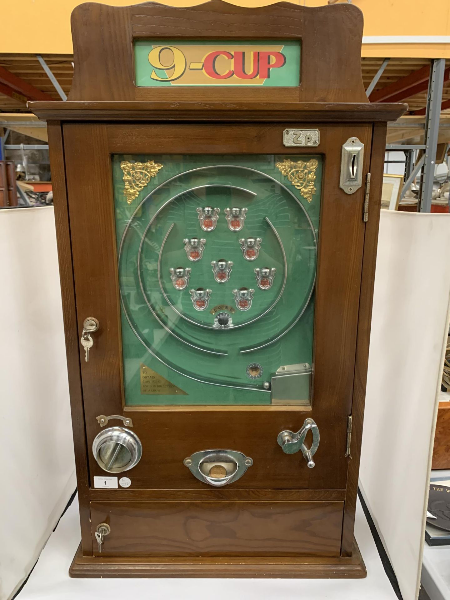 A VINTAGE 'NOSTALGIA MACHINES' NINE CUP ANFSTRIKE PENNY ARCADE GAME MACHINE