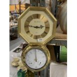 AN OCTAGONAL WALL CLOCK PLUS A BRASS STYLE ROUND BAROMETER