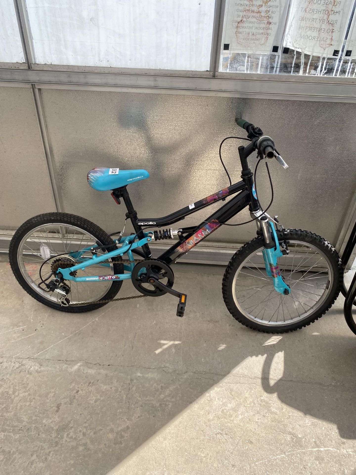 A GIRLS APOLLO BIKE WITH FRONT AND REAR SUSPENSION AND 6 SPEED SHIMANO GEAR SYSTEM