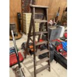 A VINTAGE FIVE RUNG WOODEN STEP LADDER