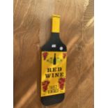 A WOODEN HAND PAINTED RED WINE BOTTLE SIGN