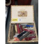 A BOX OF VINTAGE SWISS ARMY KNIVES